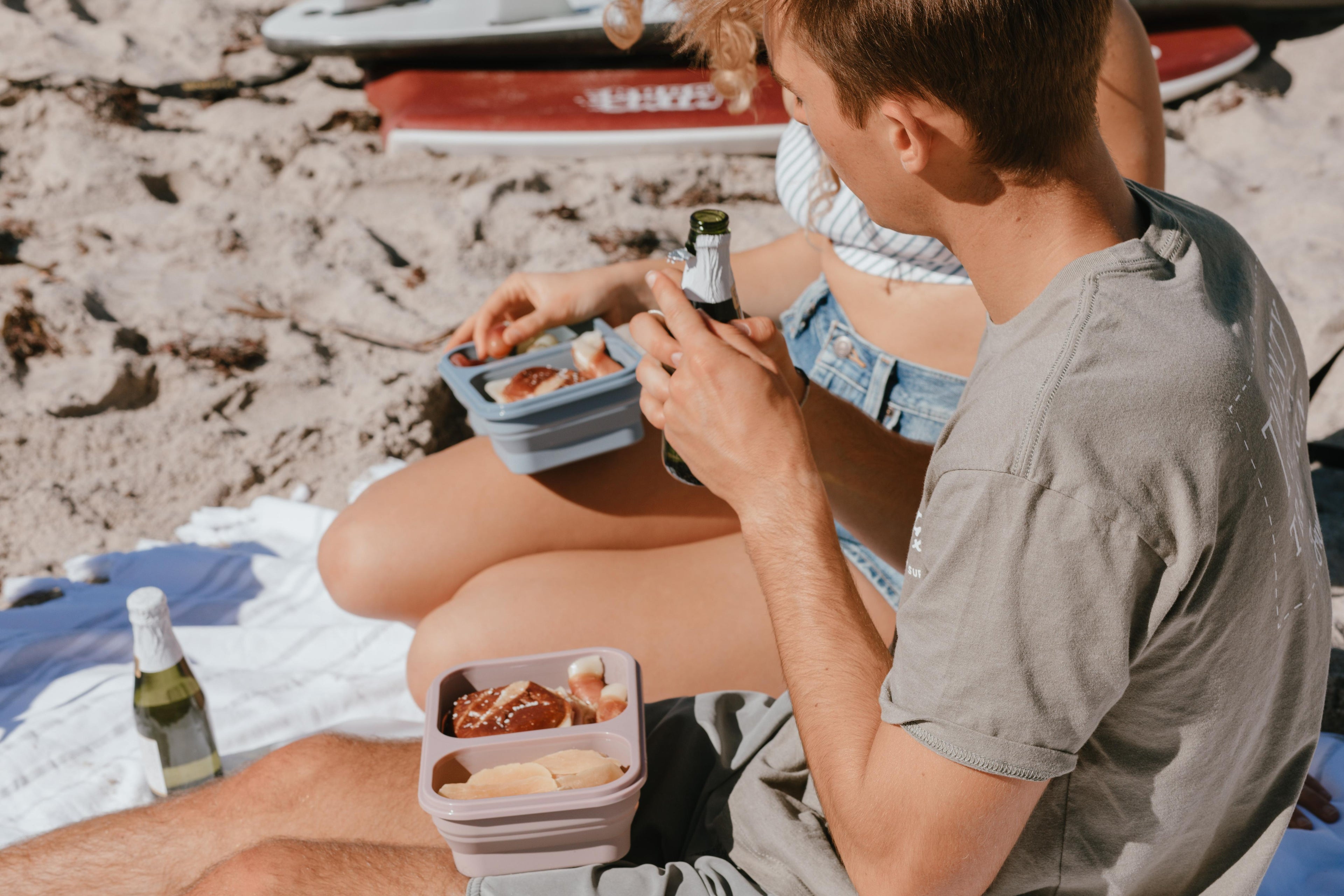 orzo bento box at the beach with picnic food and friends